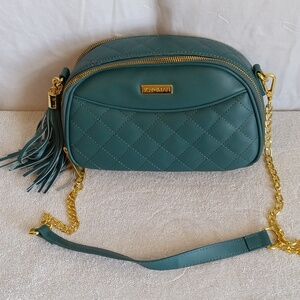 Joy and Iman blue purse shell 100 percent leather lining 100 percent polyester